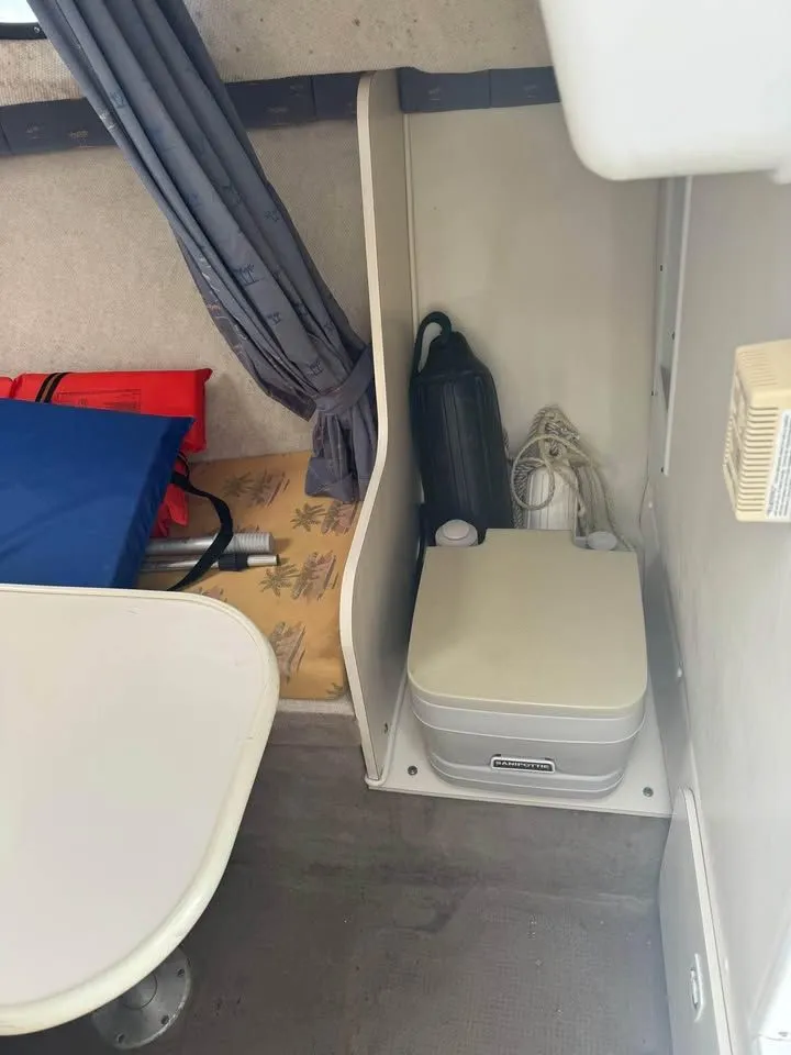 Slide: The Image of Interior of a 2004 Wellcraft WALK AROUND with portable toilet. - 4