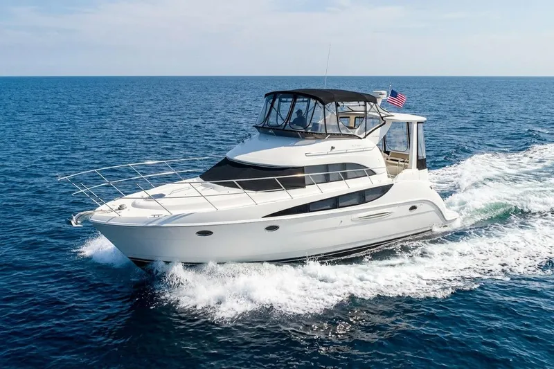 The Image of 2005 Meridian 459 Motoryacht cruising on open sea under clear skies. - 0