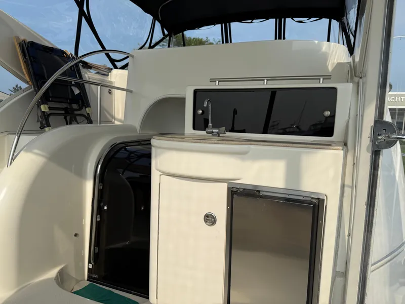 Slide: The Image of 2005 Meridian 459 Motoryacht interior with helm, sink, and storage area. - 13