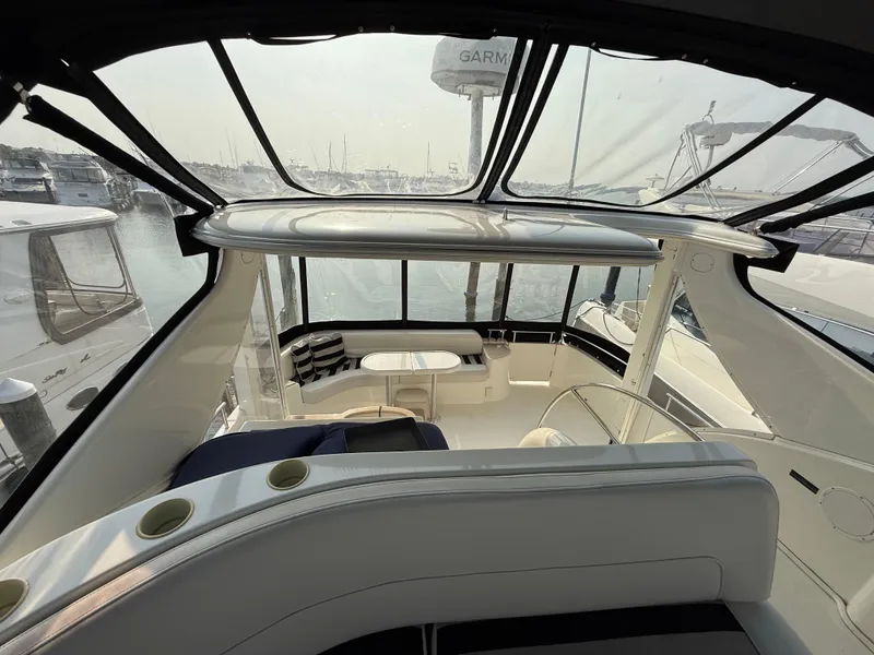 Slide: The Image of 2005 Meridian 459 Motoryacht interior with panoramic windows and seating area. - 21