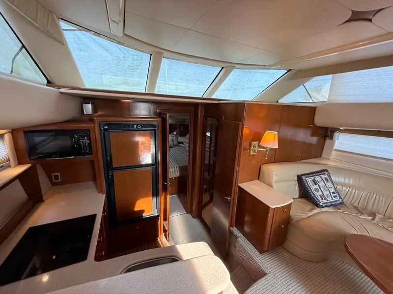Slide: The Image of Interior of 2005 Meridian 459 Motoryacht with modern kitchen and cozy seating area. - 24