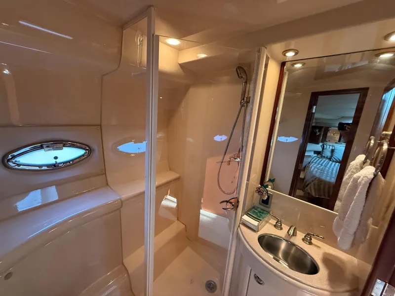 Slide: The Image of Luxurious bathroom in 2005 Meridian 459 Motoryacht with shower, sink, and mirror. - 42