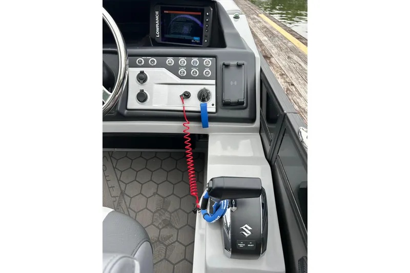 Slide: The Image of 2025 South Bay 525UL393 boat dashboard with controls and Lowrance display. - 20