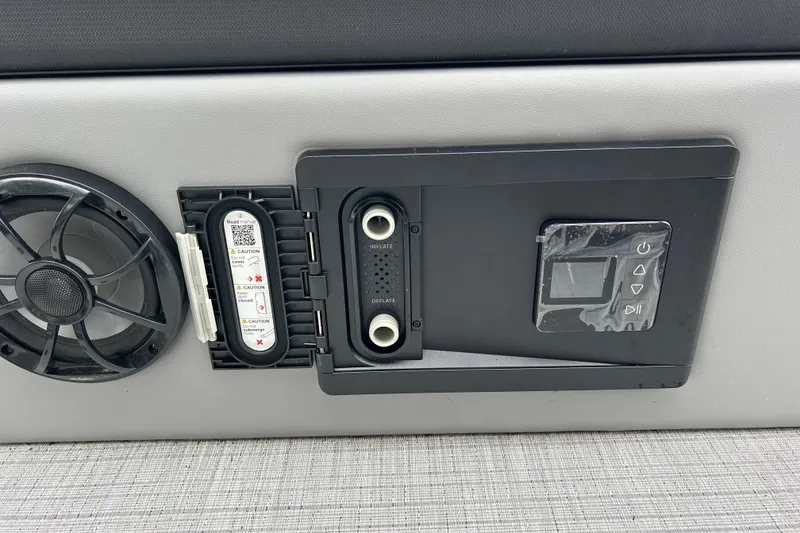 Slide: The Image of Control panel of a 2025 South Bay 525UL393 boat with speaker and digital display. - 36
