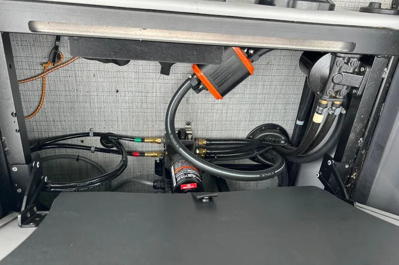 Slide: The Image of Interior view of 2025 South Bay 525UL393 boat's mechanical components and wiring. - 43