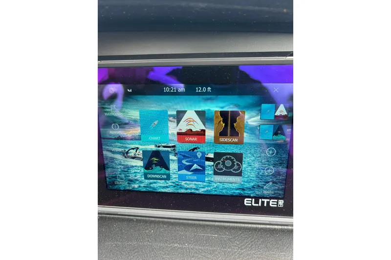 Slide: The Image of Touchscreen display of 2025 South Bay 525 Tritoon with navigation and sonar features. - 45