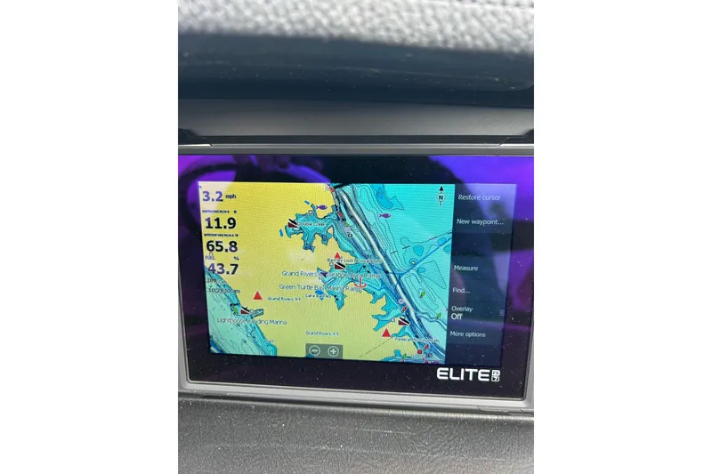 Slide: The Image of GPS navigation screen on 2025 South Bay 525 Tritoon boat, displaying map and speed data. - 47