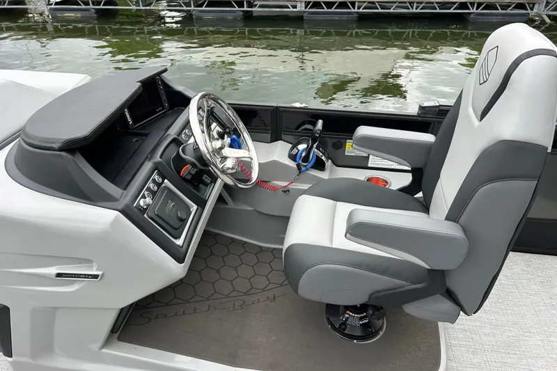 Slide: The Image of Modern 2025 South Bay 525UL393 boat cockpit with sleek steering and comfortable seating. - 21