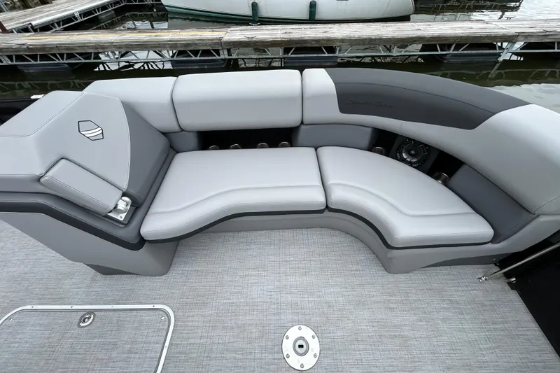 Slide: The Image of Luxurious seating on 2025 South Bay 525UL393 pontoon boat at dockside. - 25