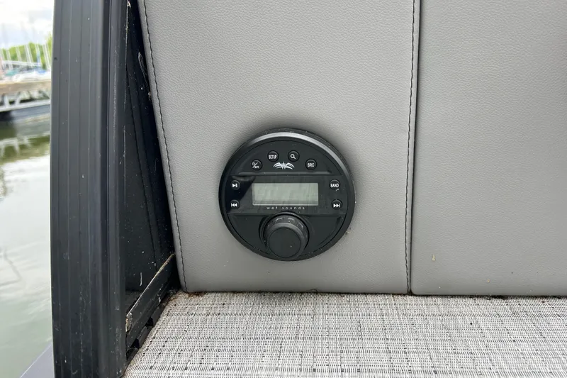 Slide: The Image of Control panel on 2025 South Bay 525UL393 boat, featuring a sleek black design. - 35