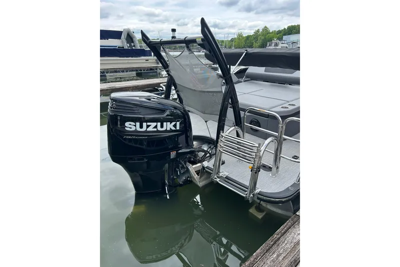 Slide: The Image of 2025 South Bay 525UL393 boat with Suzuki outboard motor at dock. - 4