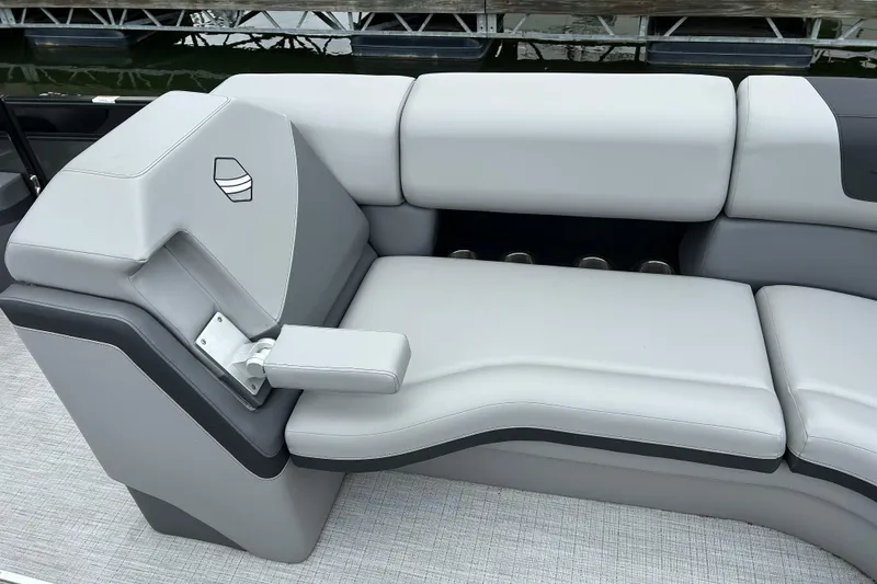 Slide: The Image of Luxurious seating on 2025 South Bay 525UL393 pontoon boat, featuring sleek gray upholstery. - 40