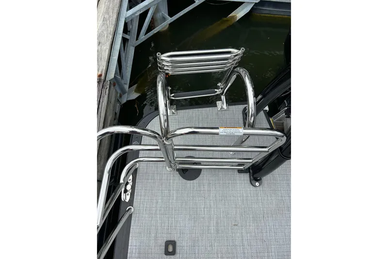 Slide: The Image of Stainless steel boat ladder on South Bay 525UL393, 2025 model, docked by water. - 41