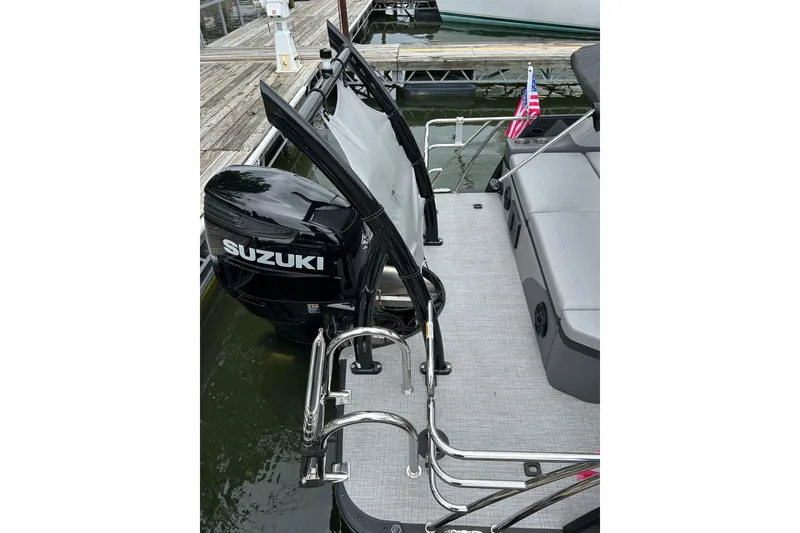 Slide: The Image of 2025 South Bay 525UL393 boat with Suzuki outboard motor at dockside. - 42