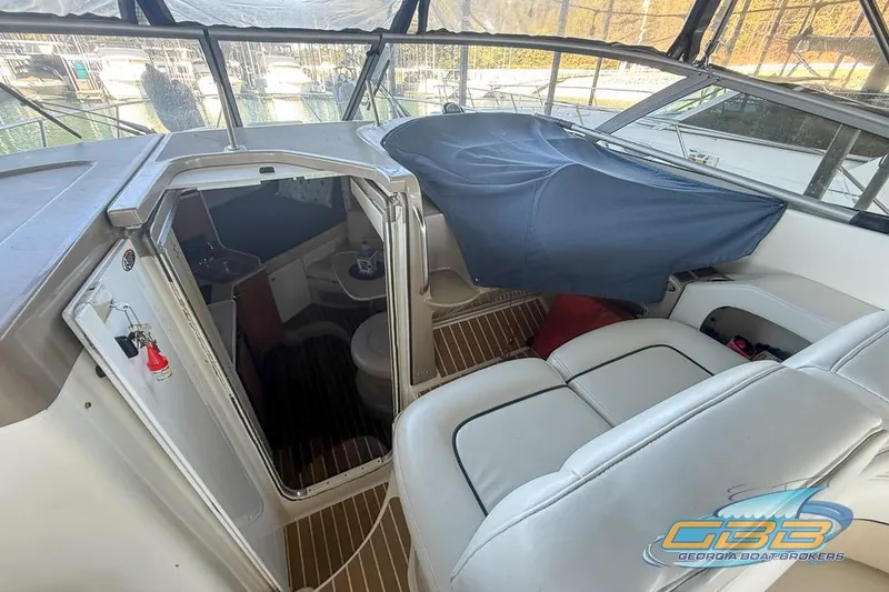 Slide: The Image of Interior view of a 2002 Bayliner 3055 Ciera boat with seating and cabin access. - 13