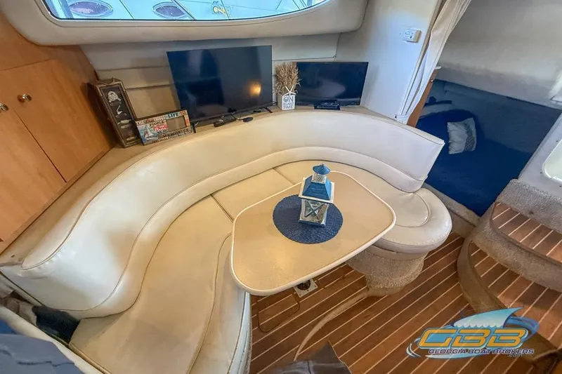 Slide: The Image of Interior of 2002 Bayliner 3055 Ciera with cozy seating and modern decor. - 2
