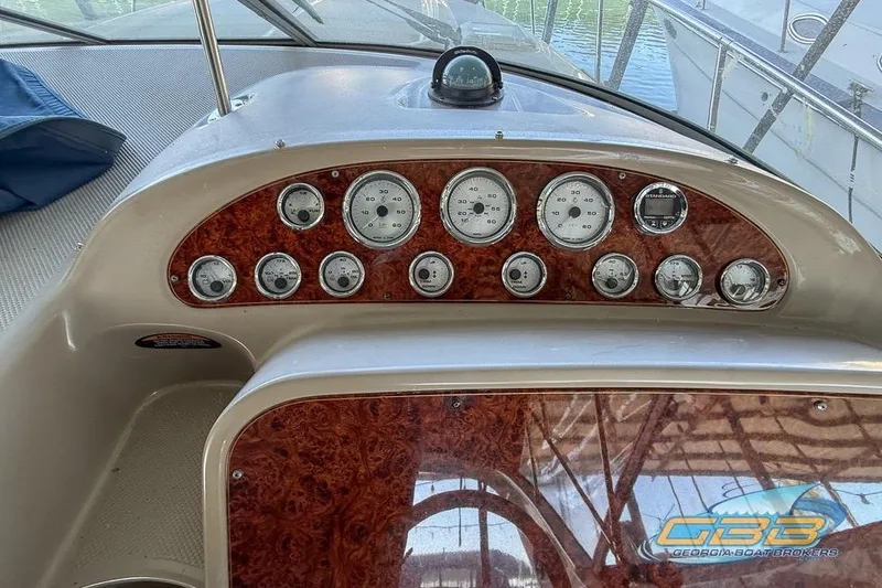 Slide: The Image of Dashboard of a 2002 Bayliner 3055 Ciera boat with gauges and controls. - 9
