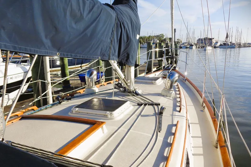 Slide: The Image of Sailboat deck view of 1997 Pacific Seacraft 37, docked in a marina. - 8