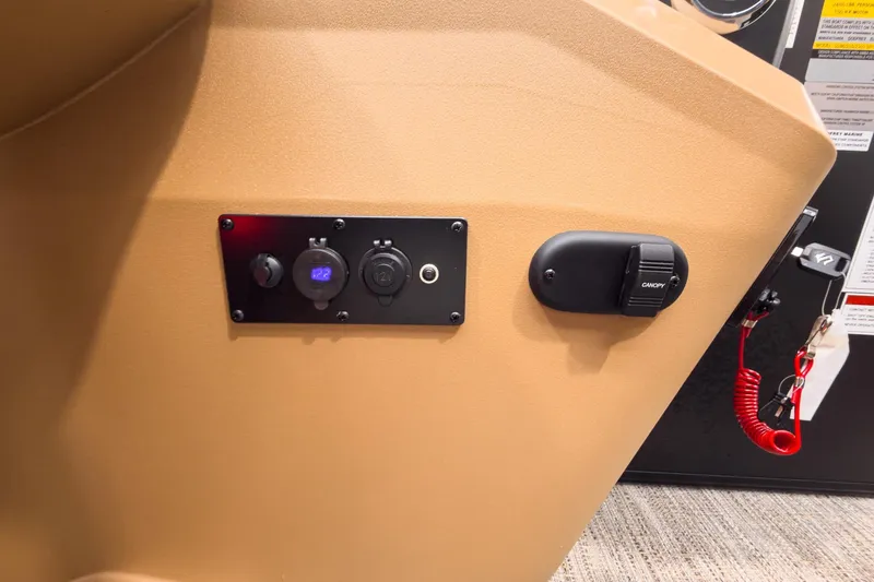 Slide: The Image of Control panel of 2026 Godfrey Sweetwater 22' Tritoon boat, featuring switches and canopy control. - 14