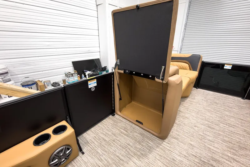 Slide: The Image of Interior of 2026 Godfrey Sweetwater Tritoon with flip lounge and storage compartment. - 18