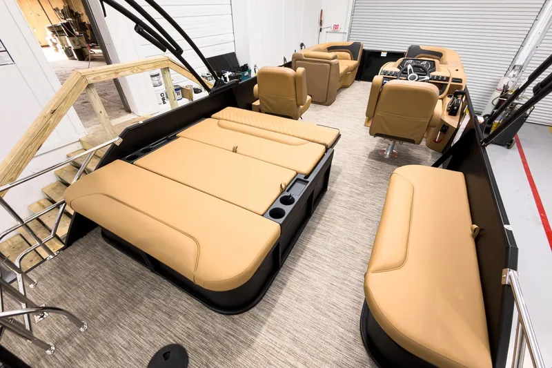 Slide: The Image of Luxurious interior of 2026 Godfrey Sweetwater 22' Tritoon with tan seating and modern design. - 20