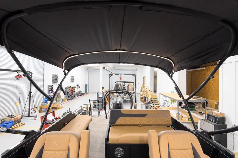 Slide: The Image of Interior view of 2026 Godfrey Sweetwater 22' Tritoon boat in a workshop. - 26