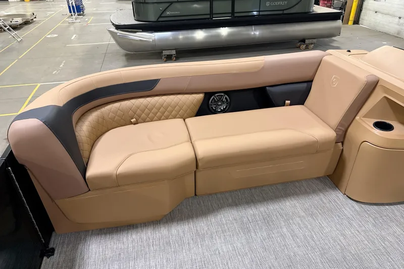 Slide: The Image of Luxurious seating on 2026 Godfrey Sweetwater 22' Tritoon, featuring tan upholstery and modern design. - 35