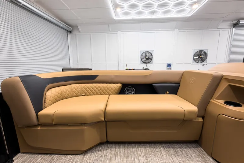 Slide: The Image of Luxurious interior of 2026 Godfrey Sweetwater 22' Tritoon with tan leather seating. - 7