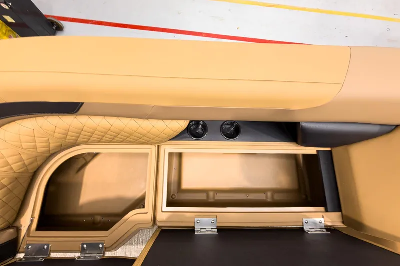 Slide: The Image of Interior view of 2026 Godfrey Sweetwater 22' Tritoon, featuring storage compartments and cup holders. - 9