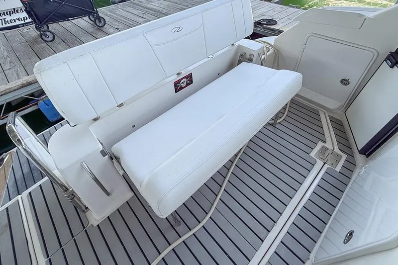 Slide: The Image of 2006 Regal 3060 Window Express boat interior with white seating and striped flooring. - 19