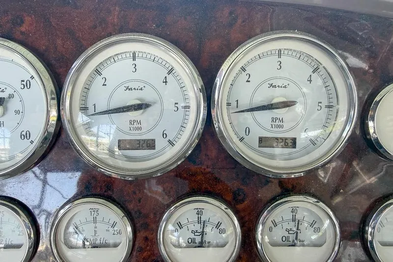Slide: The Image of Dashboard gauges of a 2006 Regal 3060 Window Express boat. - 22