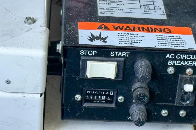 Slide: The Image of Control panel of a 2006 Regal 3060 Window Express with warning label and switches. - 27