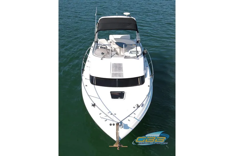 Slide: The Image of 2006 Regal 3060 Window Express boat on water, aerial view. - 9