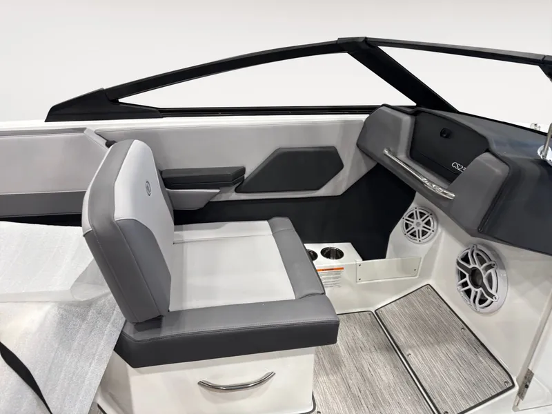 Slide: The Image of Interior of 2026 Cobalt CS23 boat with gray seating and speakers. - 10