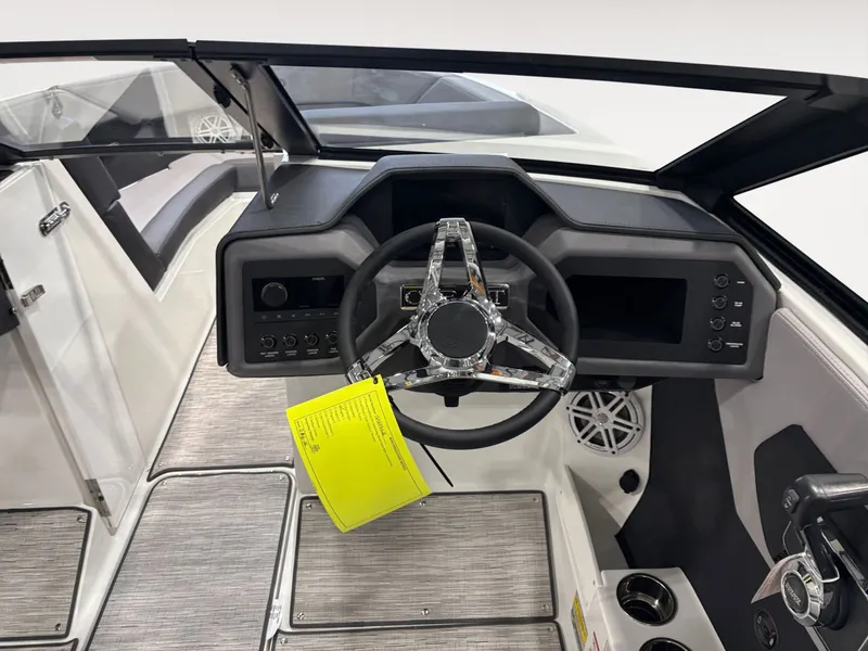 Slide: The Image of Interior view of 2026 Cobalt CS23 boat cockpit with modern steering wheel. - 11