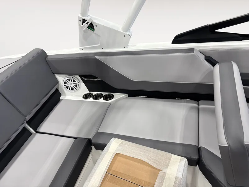 Slide: The Image of Interior of Cobalt CS23 boat, gray upholstery, speaker, and cup holders. - 13