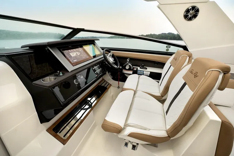 Slide: The Image of Manufacturer Provided Image: 2021 Sea Ray SLX 400 helm with dual captain's chairs and advanced navigation system. - 15