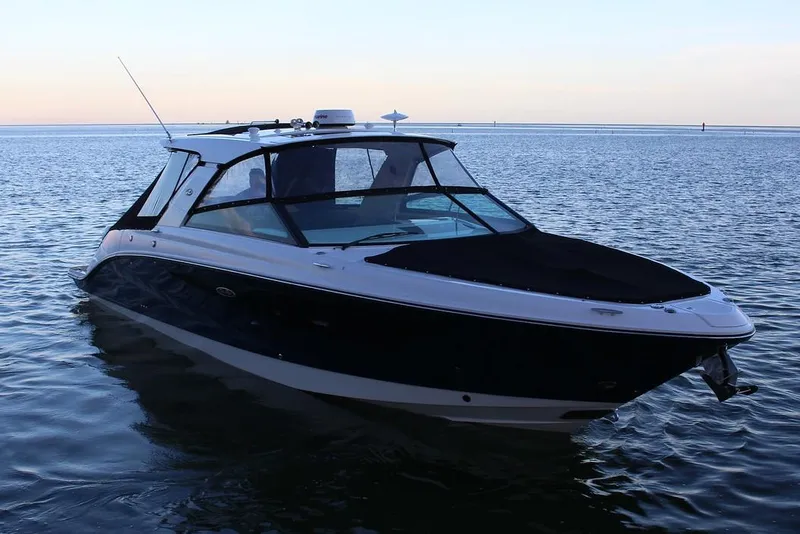 Slide: The Image of Manufacturer Provided Image: 2021 Sea Ray SLX 400 boat on calm water at sunset. - 3