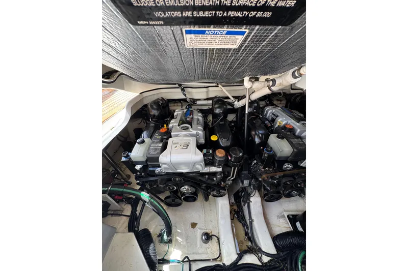 Slide: The Image of Engine compartment of a 2021 Sea Ray SLX 400 boat, showcasing dual engines. - 31