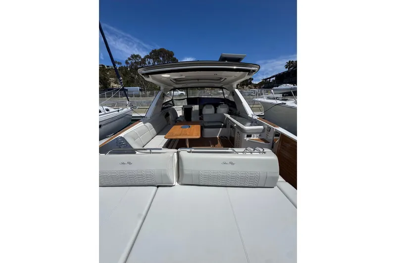 Slide: The Image of 2021 Sea Ray SLX 400 yacht with luxurious interior and seating area. - 7