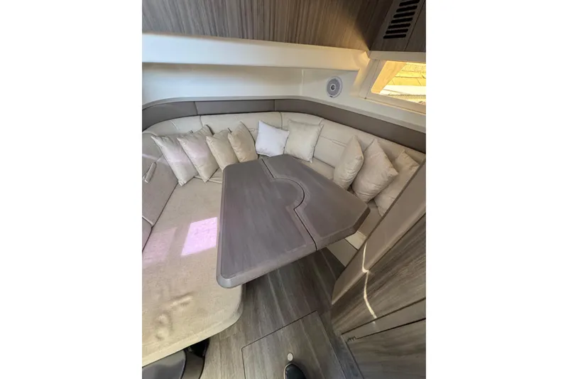 Slide: The Image of Interior of 2021 Sea Ray SLX 400 yacht with cozy seating area. - 9