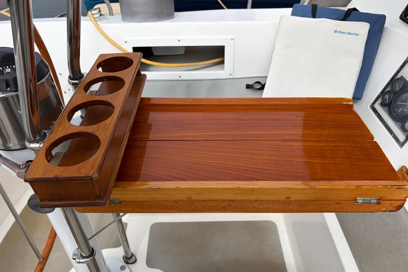 Slide: The Image of Interior of 1986 Nordic 44 yacht with beige cushions and wooden cabinetry. - 28
