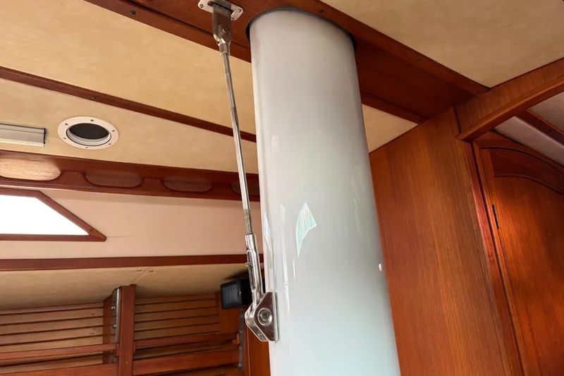 Slide: The Image of Interior of 1986 Nordic 44 sailboat showing mast support and wooden paneling. - 32