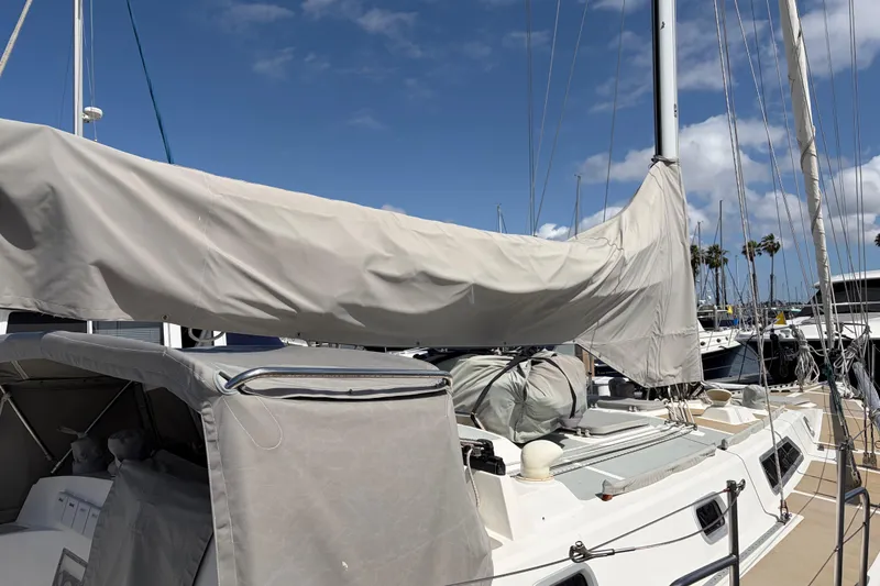 Slide: The Image of Sailboat Nordic 44, 1986 model, docked at marina under clear blue sky. - 7