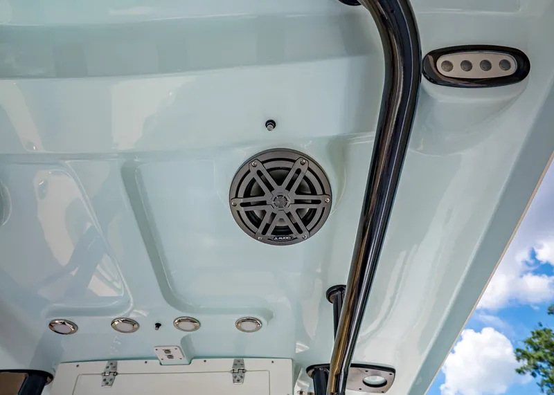Slide: The Image of Interior view of Sea Hunt Ultra 229 boat roof, speaker and sky. - 14