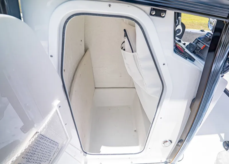 Slide: The Image of Interior of Sea Hunt Ultra 229 boat cabin, model year 2026. - 21