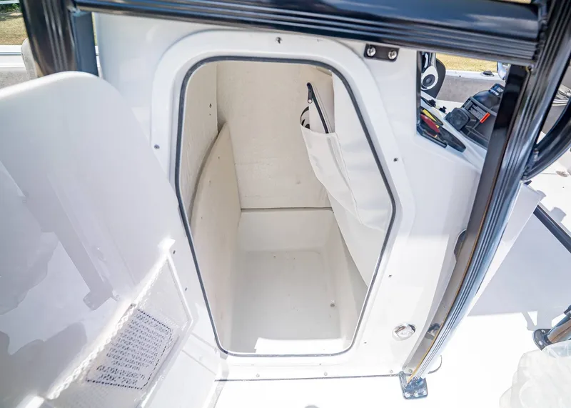 Slide: The Image of Interior of Sea Hunt Ultra 229 boat cabin, model year 2026. - 22
