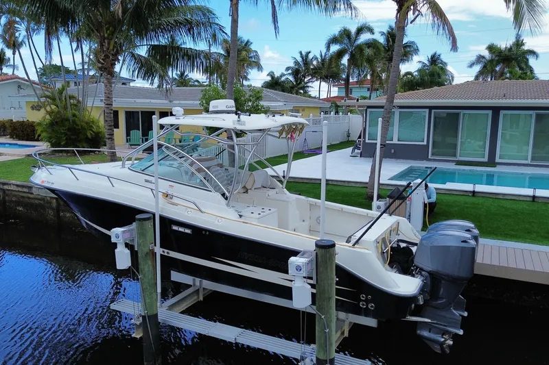 Slide: The Image of 2006 Hydra-Sports Vector 2900 VX boat docked near a modern waterfront home. - 12