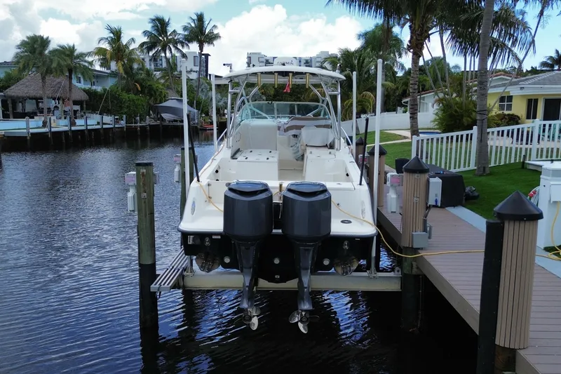 Slide: The Image of 2006 Hydra-Sports Vector 2900 VX boat docked by waterfront homes. - 14