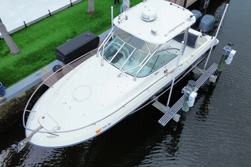Slide: The Image of 2006 Hydra-Sports Vector 2900 VX boat docked on a lift, aerial view. - 2